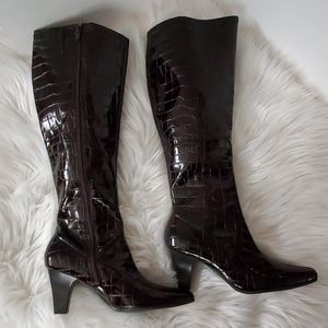 Faux snakeskin women's knee high boots.